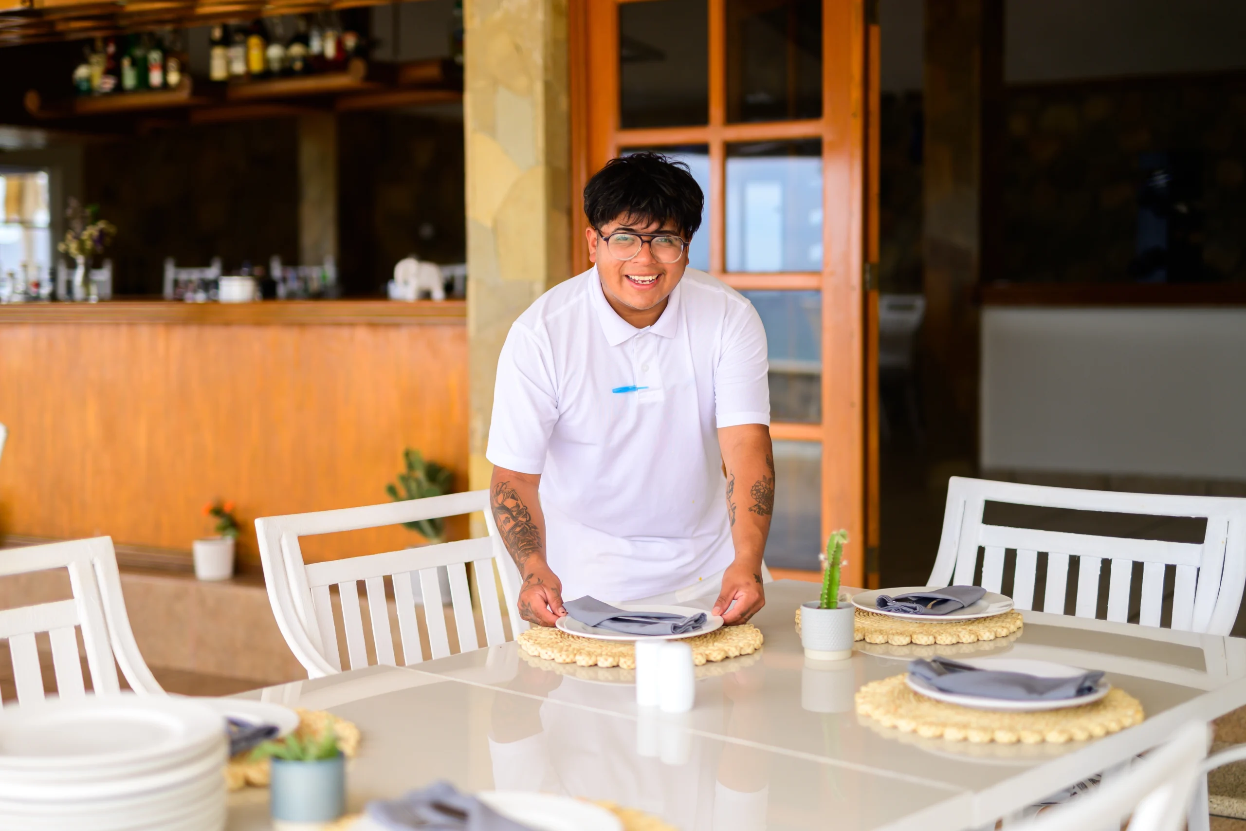 Carreras 2 a man smiling at a table